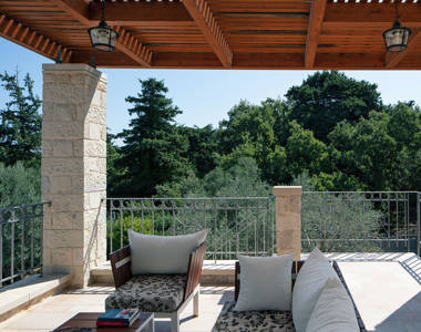 Vederi Estate Villa Melpomeni balcony with table, a couch, a chair and beautiful view