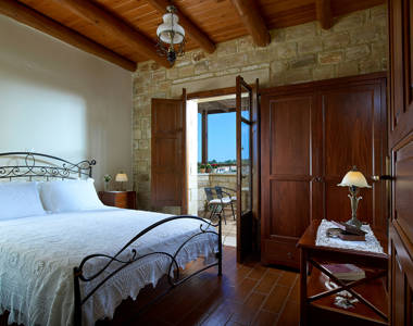 Vederi Estate Villa Kalypso bedroom with double bed, wardrobe and balcony view