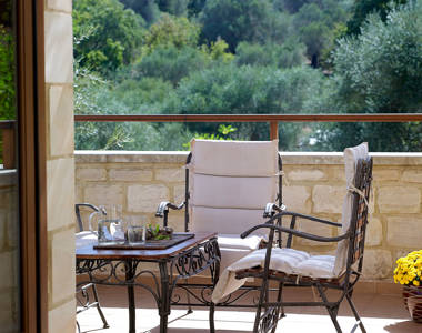 Vederi Estate Villa Kyveli balcony with small square table, chairs and beautiful mountain view