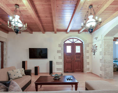 Vederi Estate Villa Melpomeni living room with wall mounted television