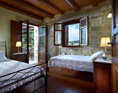Vederi Estate Villa Alkioni bedroom with a double bed and a single bed